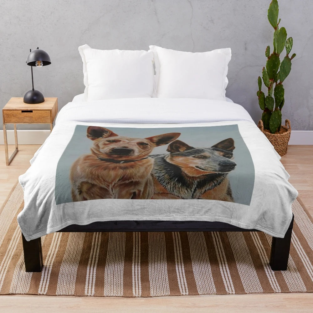 Plush blanket featuring a painting of red and blue Australian cattle dogs