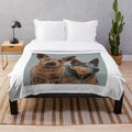 Plush blanket featuring a painting of red and blue Australian cattle dogs