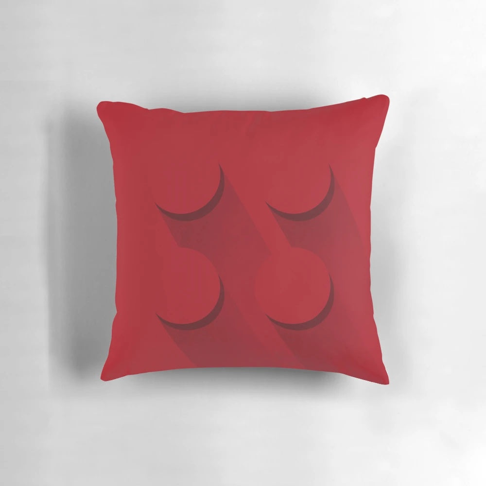A vibrant red brick-shaped pillow, perfect for LEGO® fans and minimalist decor.