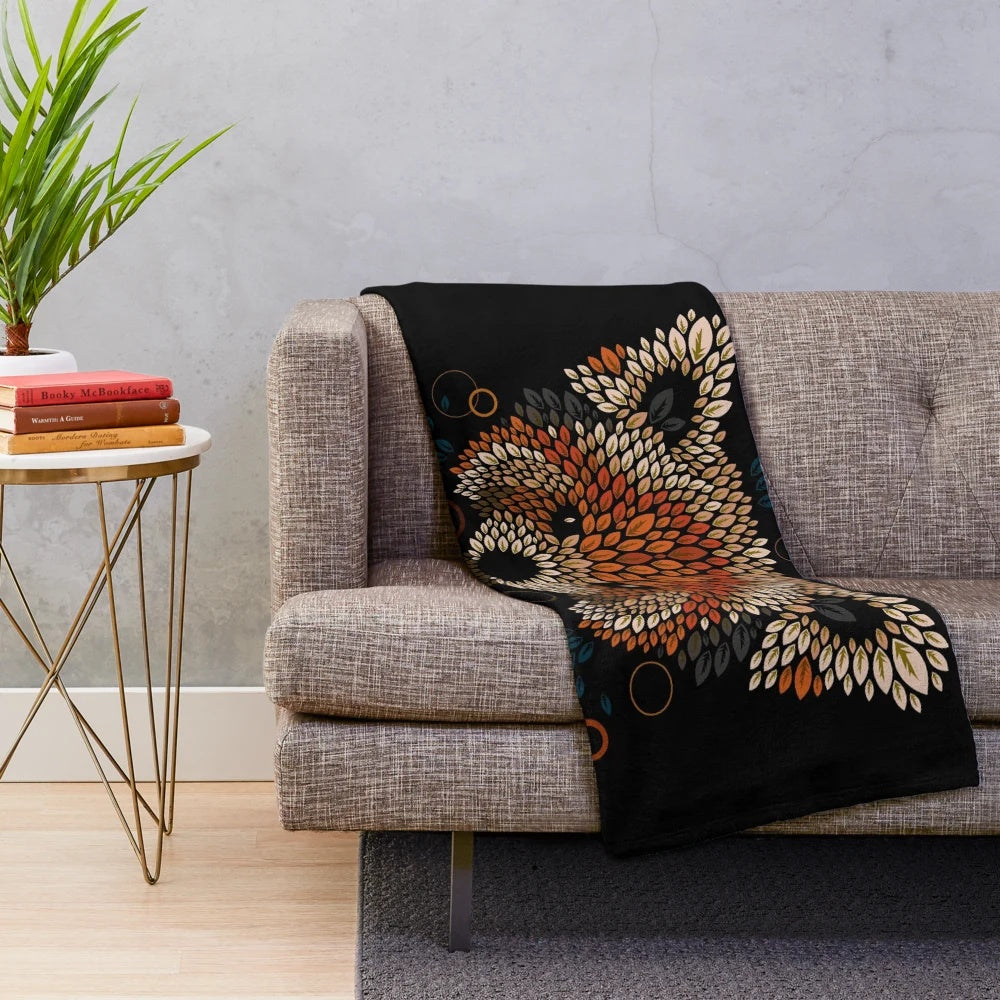 Red panda face plush blanket with geometric pattern and autumn leaves