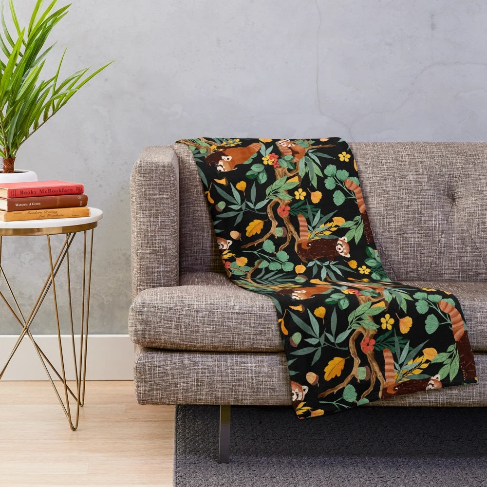Vibrant red pandas nestled in a dark, lush forest on a plush blanket