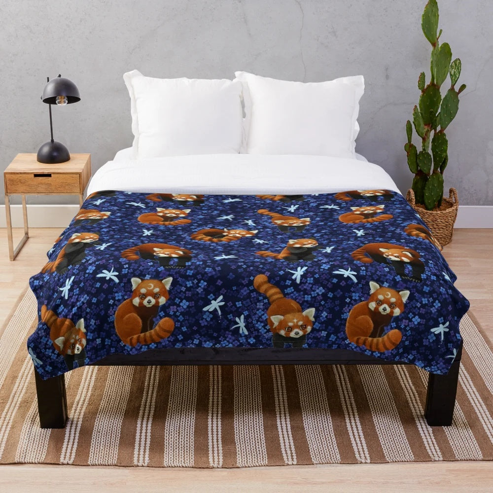 Red panda plush blanket with a colorful floral and nature-inspired pattern