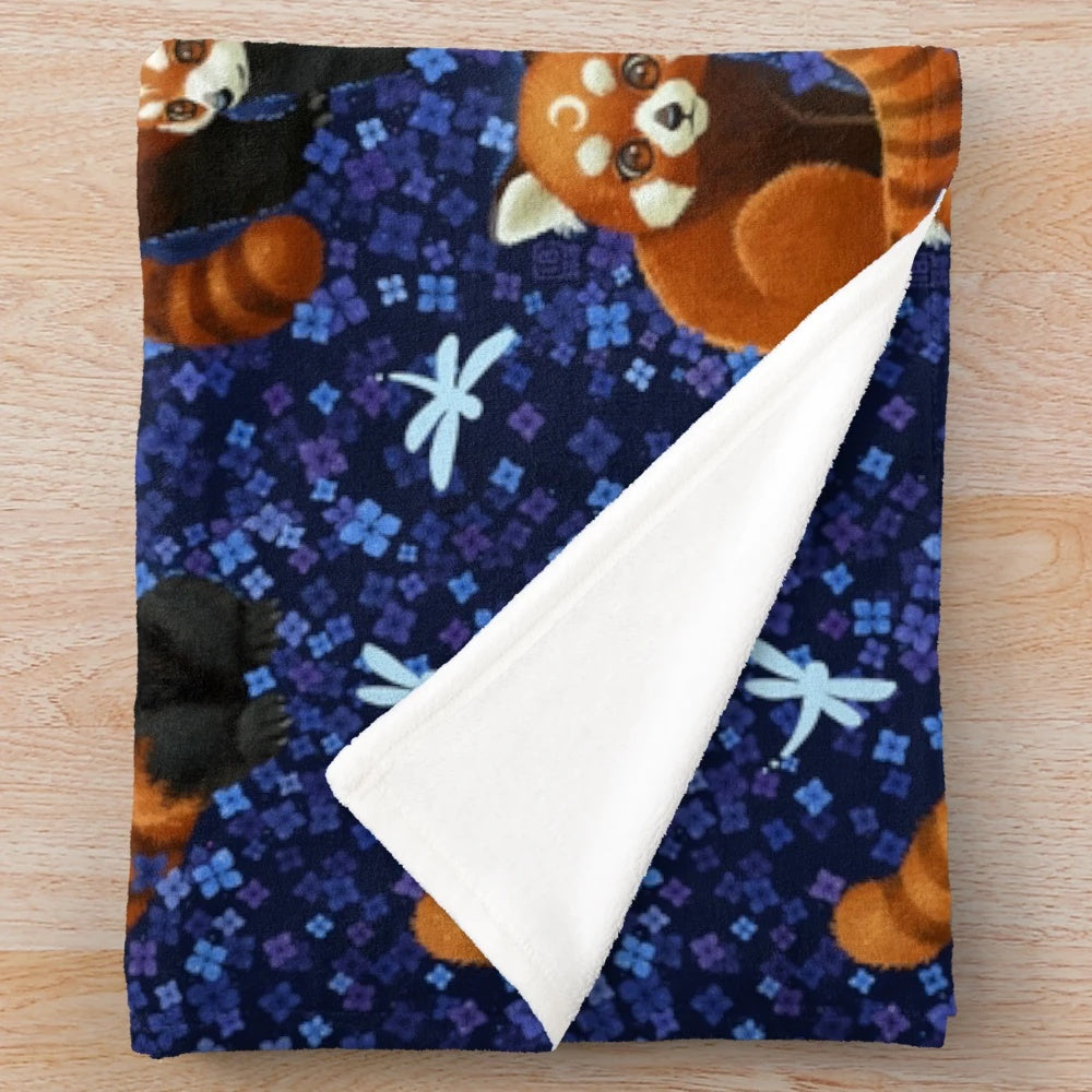 Red panda plush blanket with a colorful floral and nature-inspired pattern