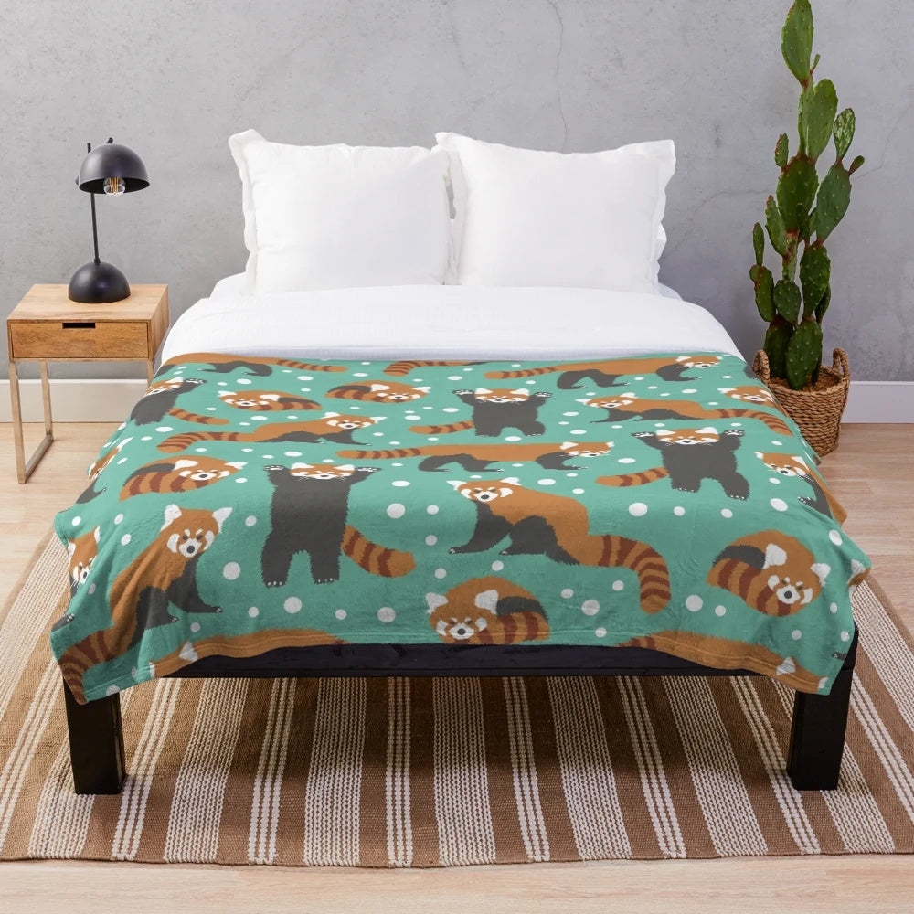 Soft and fluffy plush blanket featuring a cute red panda pattern with white dots and a turquoise background
