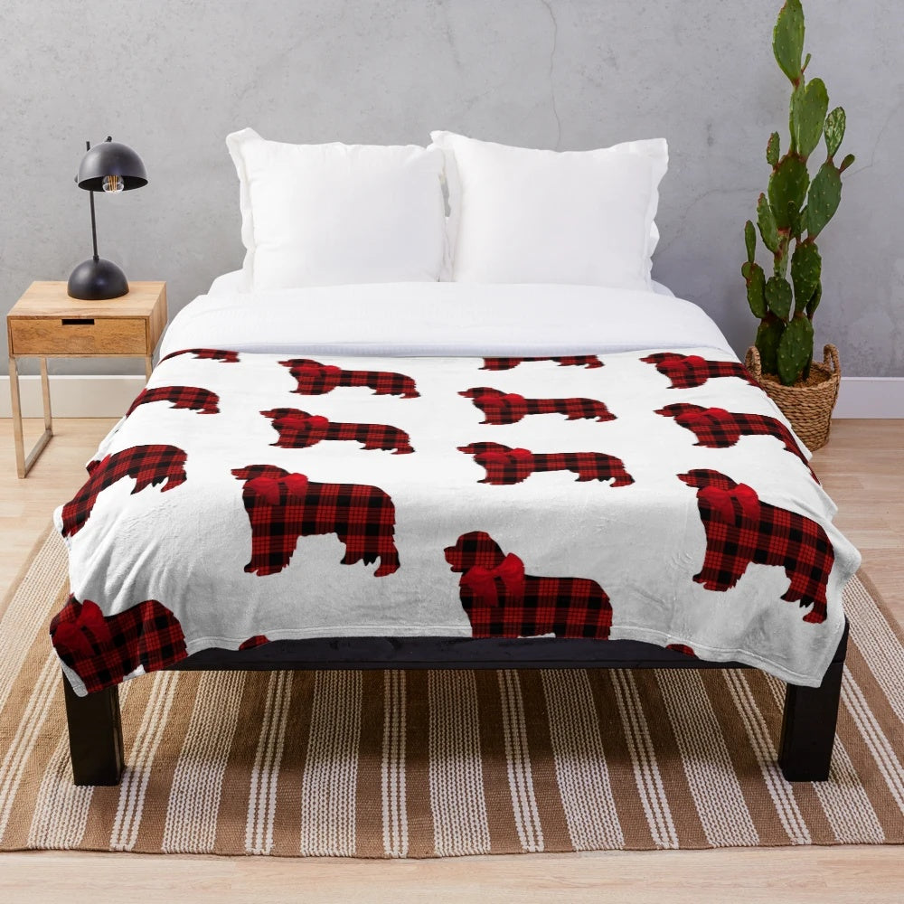 Red plaid plush blanket featuring an adorable Newfoundland dog