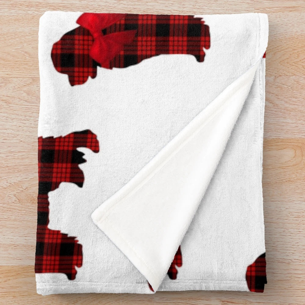 Red plaid plush blanket featuring an adorable Newfoundland dog