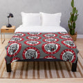 Red plush blanket with Aberdeen Lynx logo