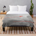 Red plush blanket with anime-inspired Staple Stable design