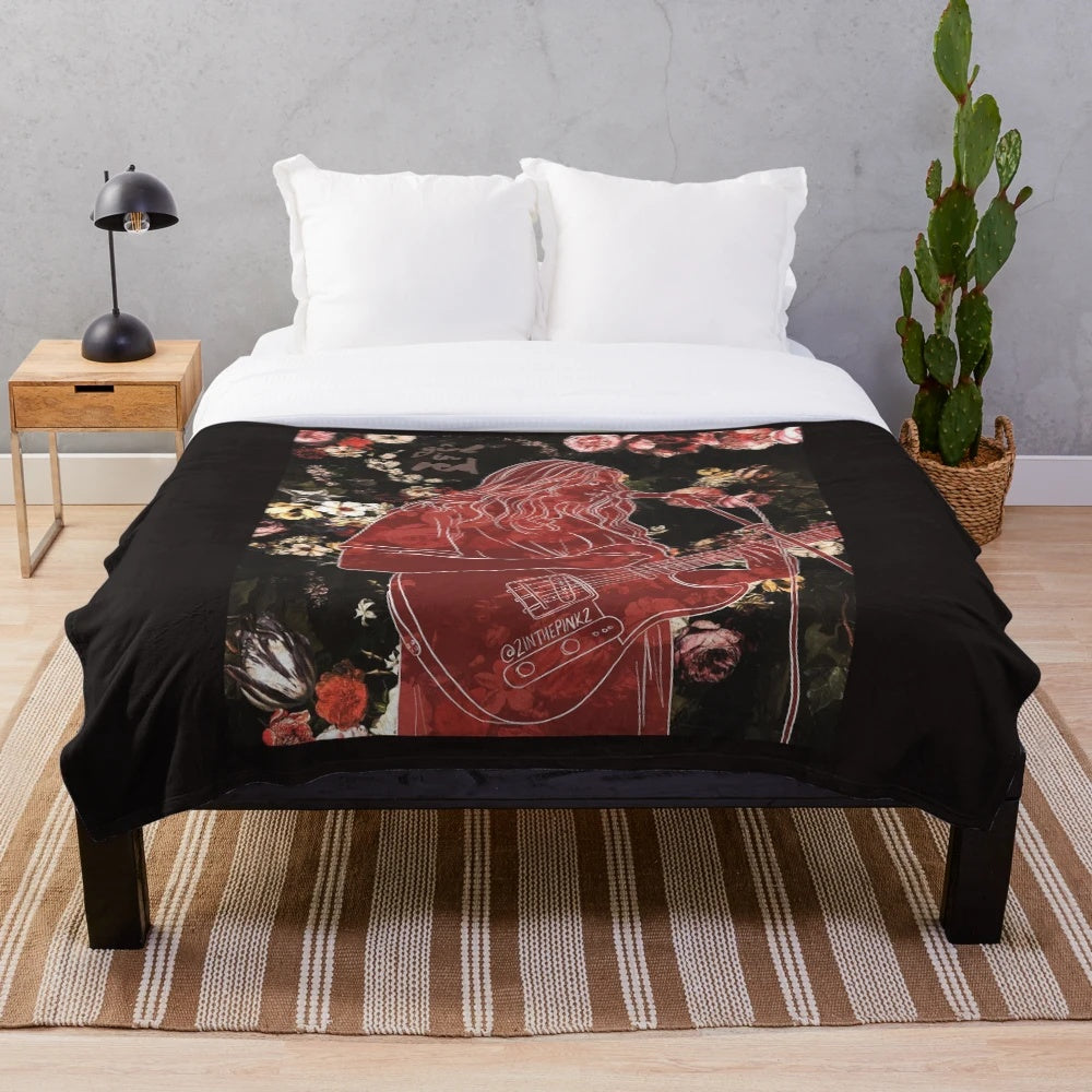 Red plush blanket with rose pattern, perfect for music lovers and lesbian pride
