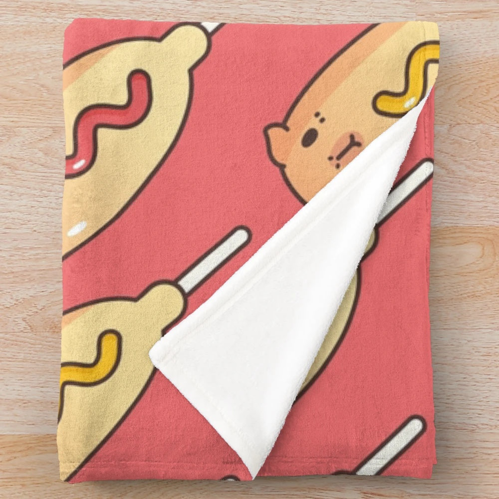 Red plush blanket with a corn dog pattern, featuring cute guinea pigs and capybaras
