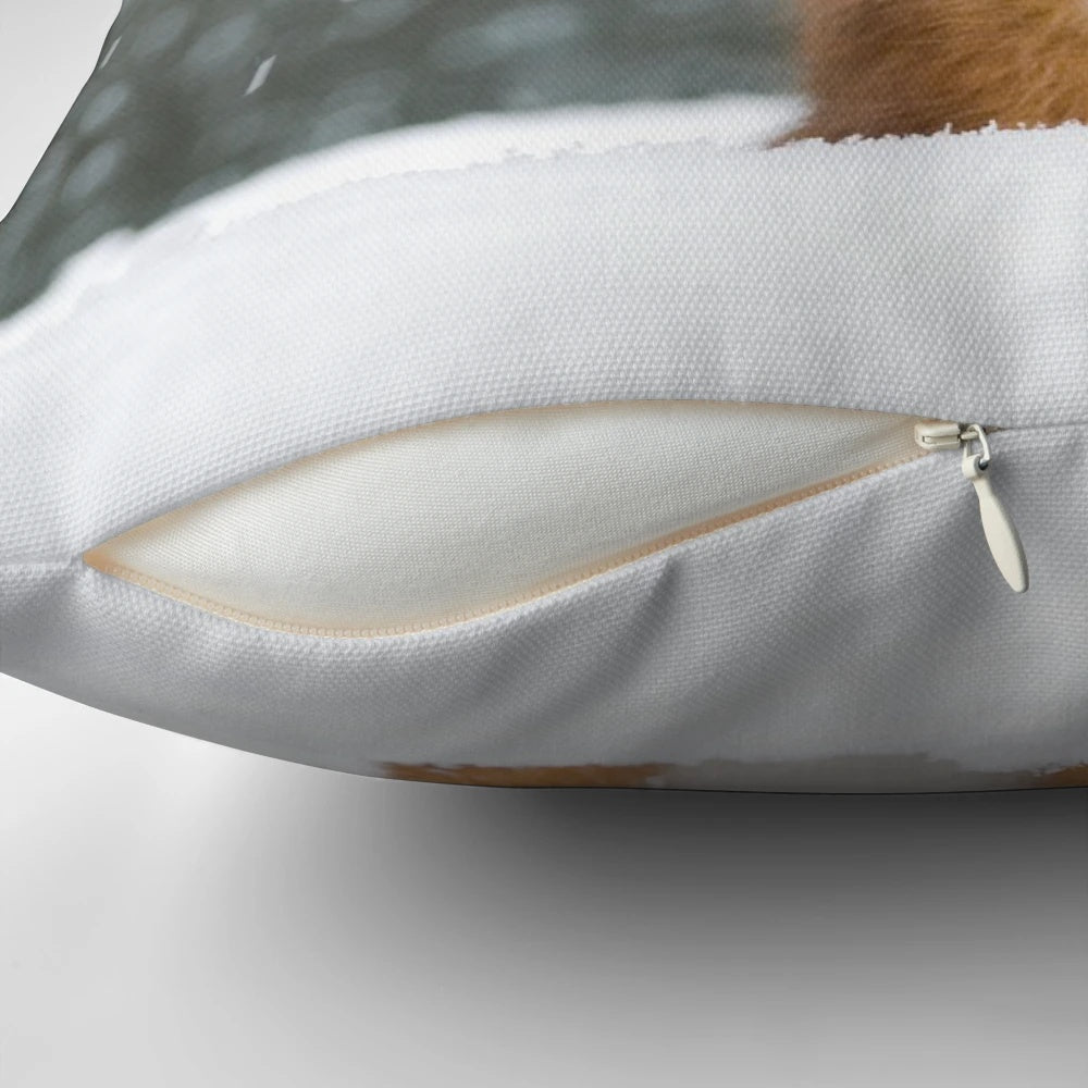 A soft, plush throw pillow featuring a charming red squirrel surrounded by a winter snowscape.