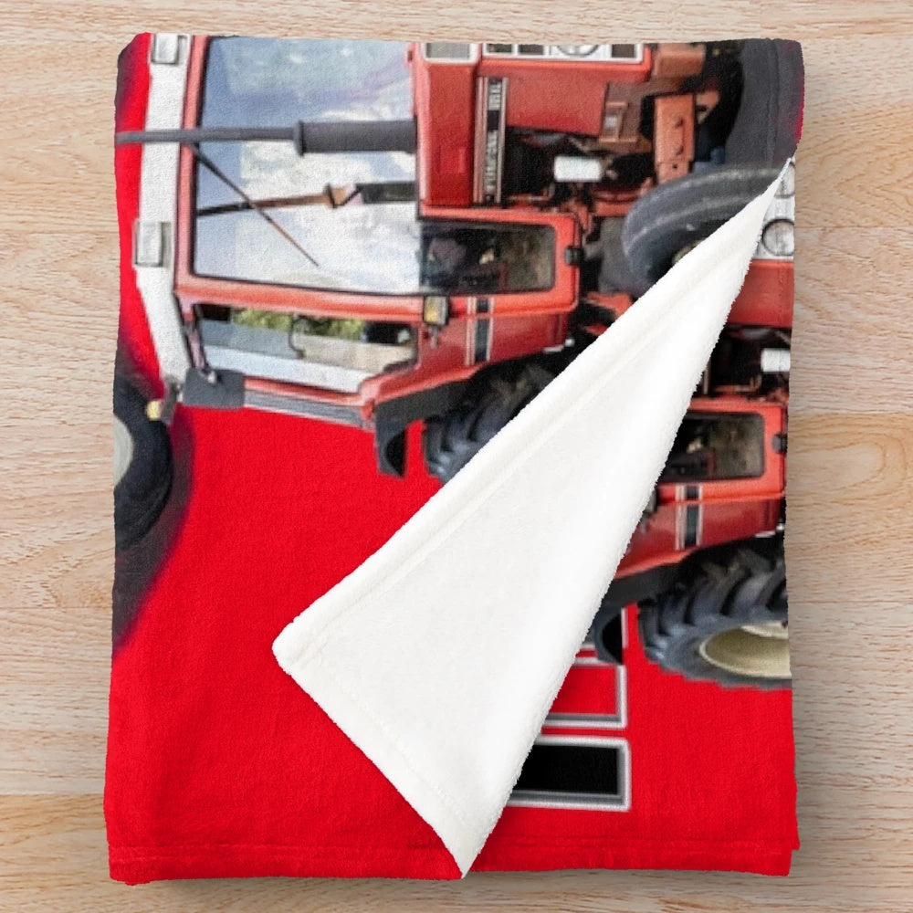 Soft and comfy red tractor plush blanket for farmhouse or country-style decor