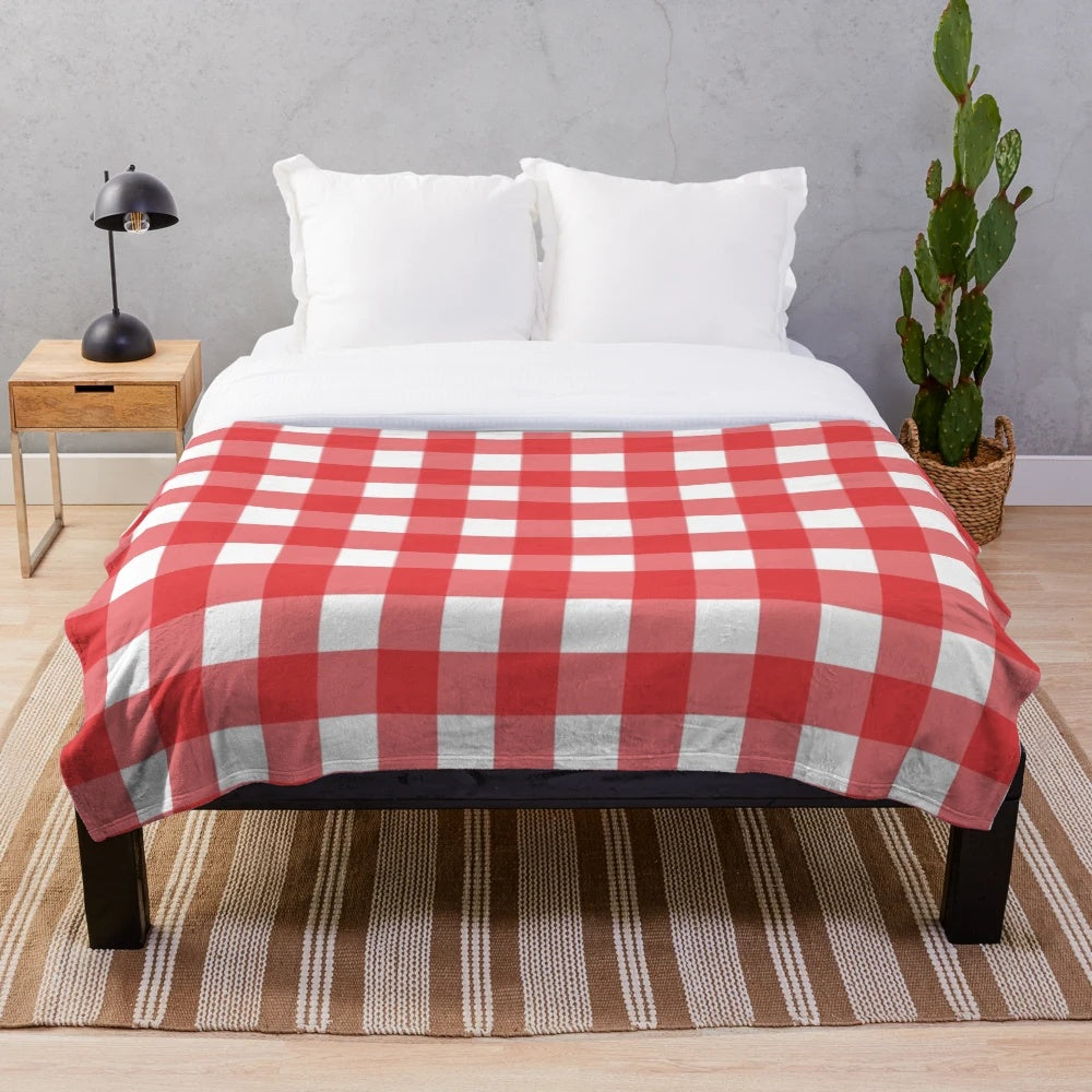 Red and white plaid pattern plush blanket with classic Scottish tartan design