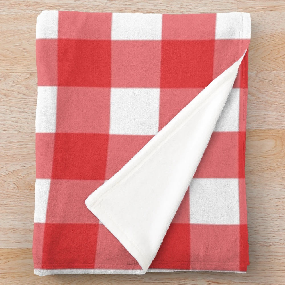 Red and white plaid pattern plush blanket with classic Scottish tartan design