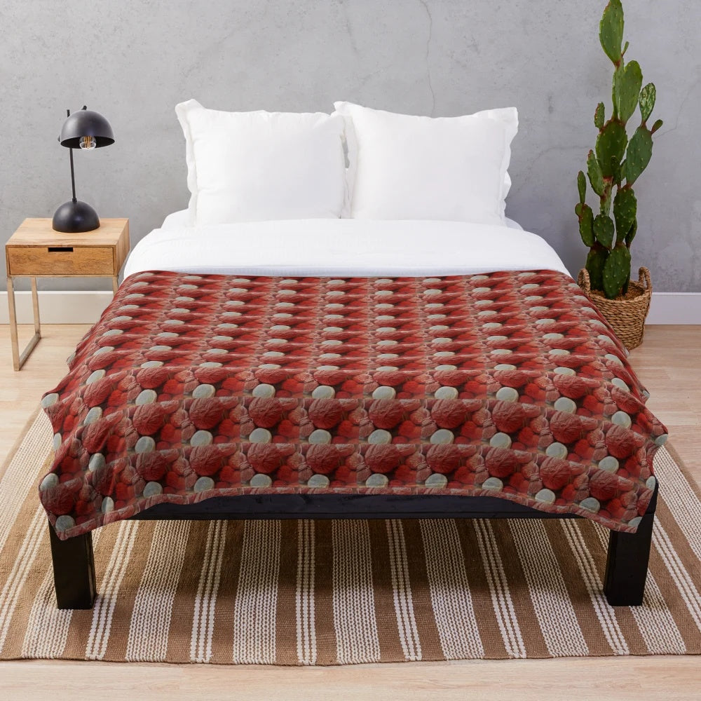 A red plush blanket made of soft, warm wool