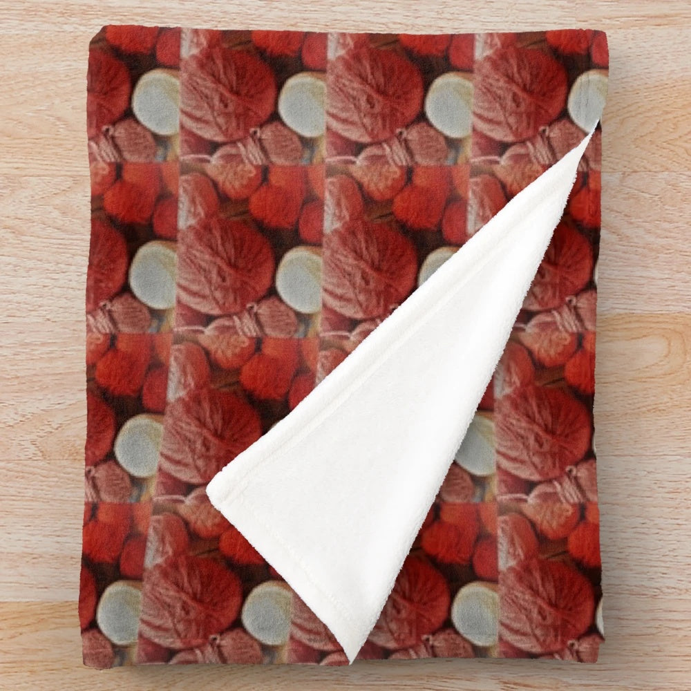 A red plush blanket made of soft, warm wool