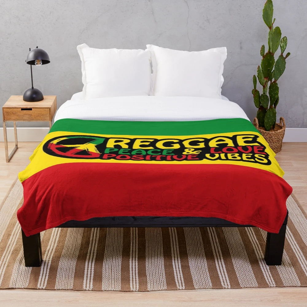 Reggae-inspired plush blanket with peace symbol and rasta colors