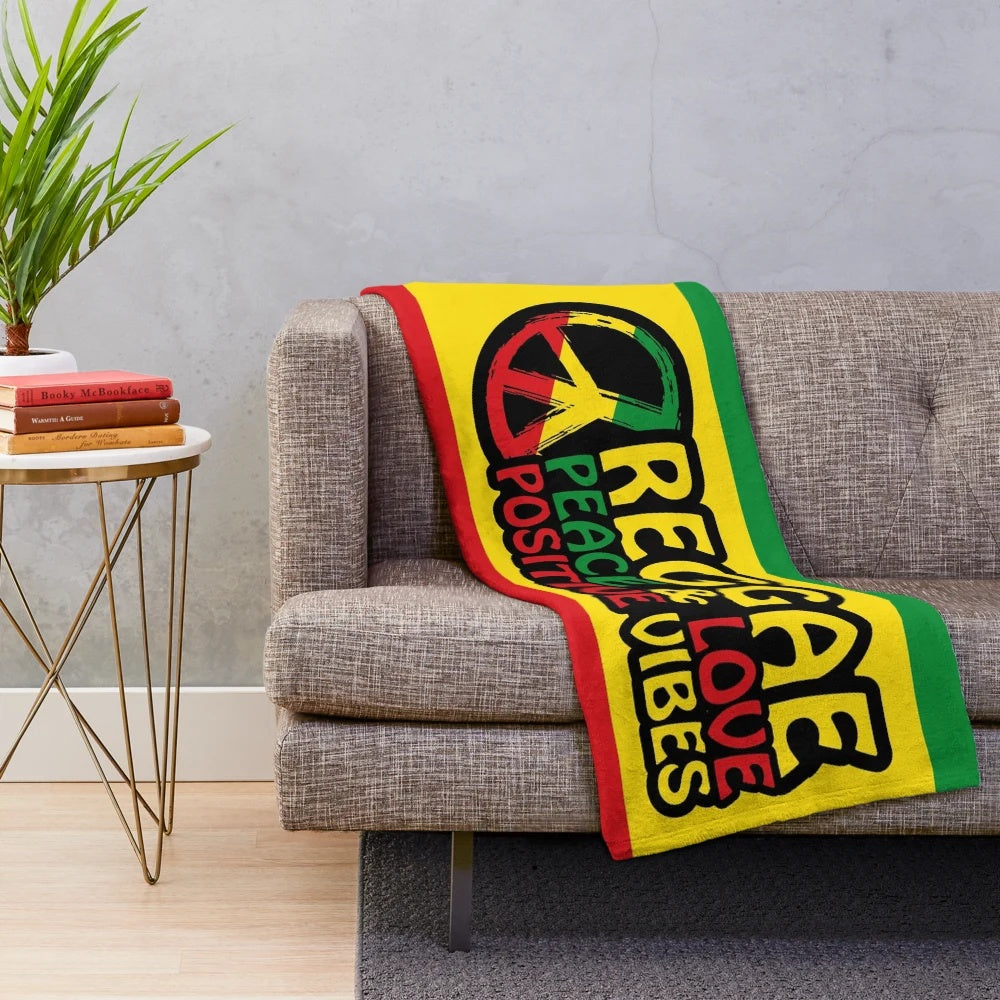 Reggae-inspired plush blanket with peace symbol and rasta colors