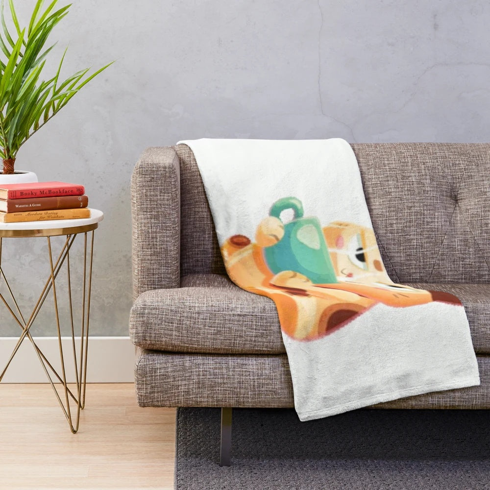 Relaxed cat curled up on a soft, plush blanket