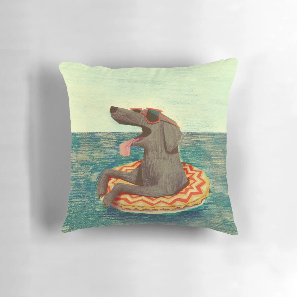 A soft, plush decorative pillow featuring a relaxed, illustrated doggo in a colorful, textured design.