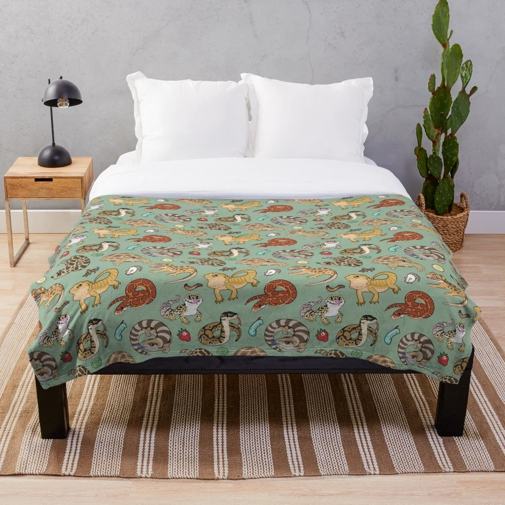 Green plush blanket with reptile pets print design