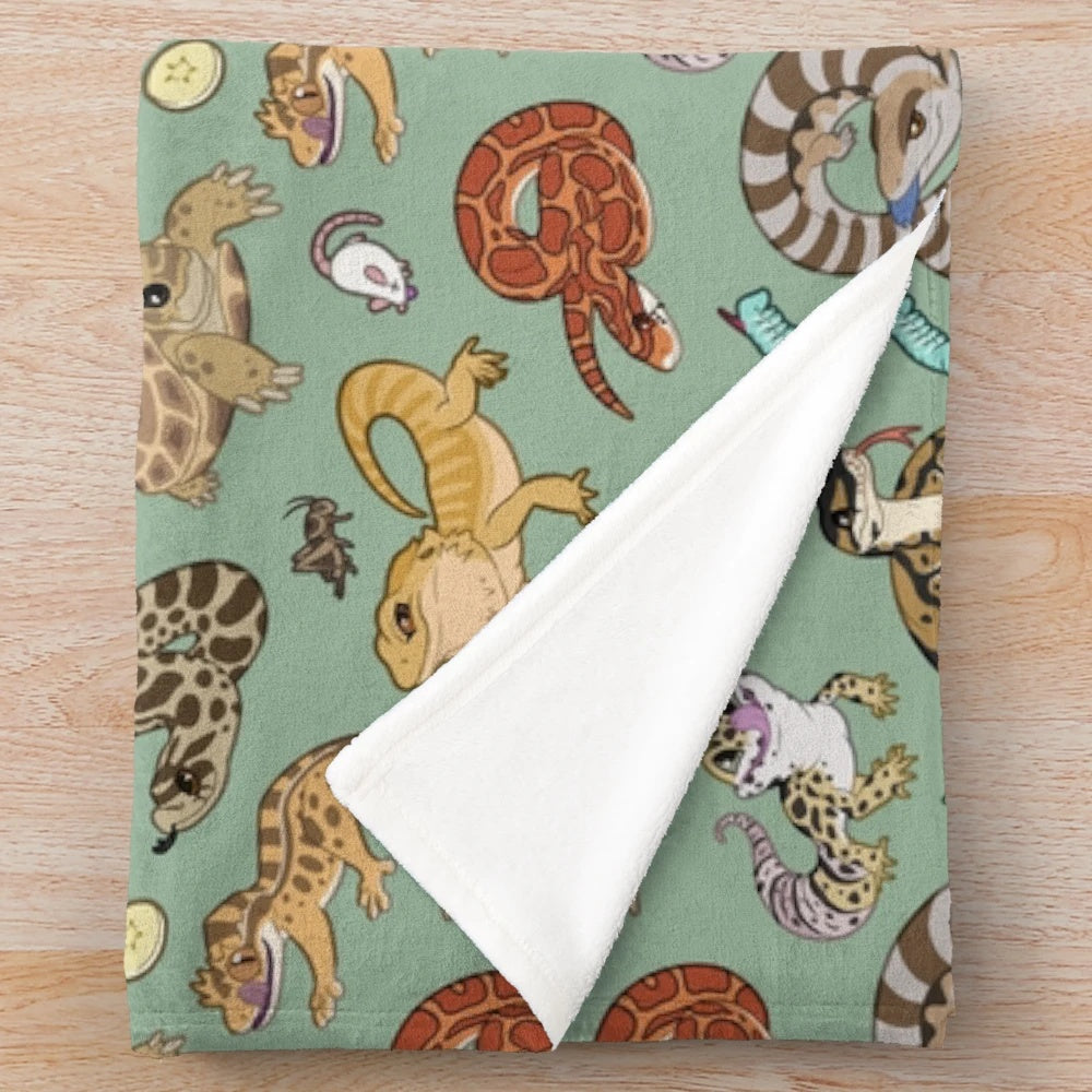 Green plush blanket with reptile pets print design