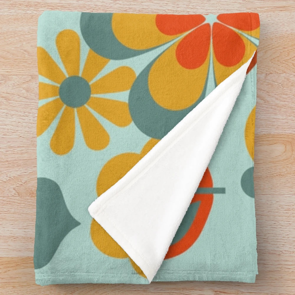 Vintage 70s flower power plush blanket in muted retro colors