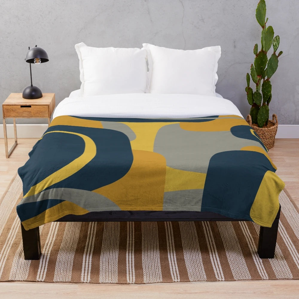 Retro abstract pattern plush blanket in navy, gray, and mustard colors