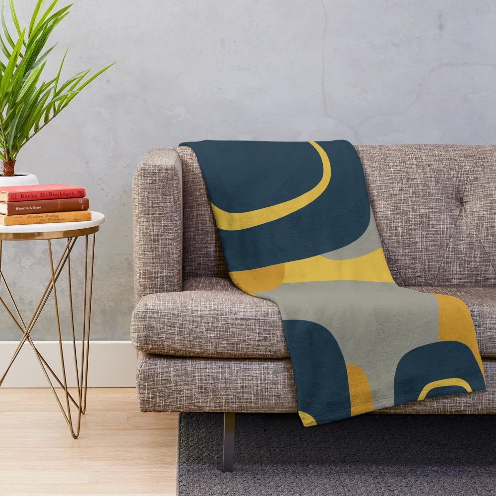 Retro abstract pattern plush blanket in navy, gray, and mustard colors