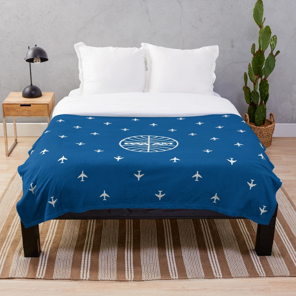 Plush blanket with classic Pan Am pattern design for aviation enthusiasts