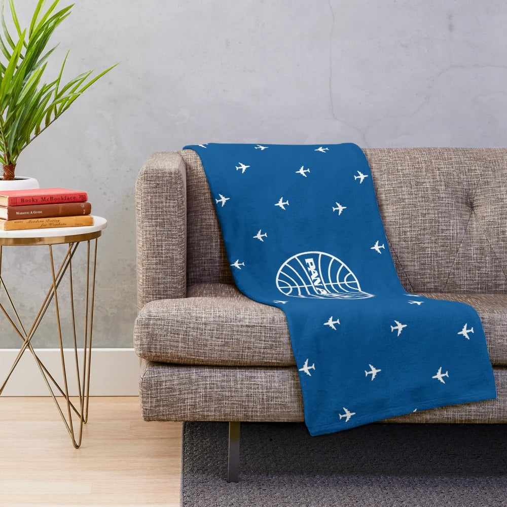 Plush blanket with classic Pan Am pattern design for aviation enthusiasts