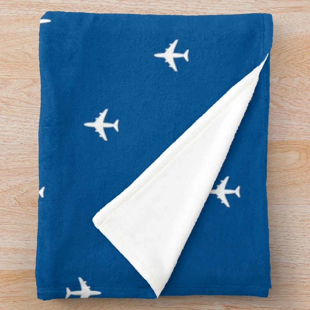 Plush blanket with classic Pan Am pattern design for aviation enthusiasts