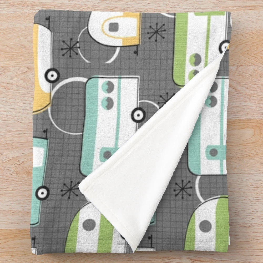 Comfy plush throw blanket with retro camper design for cozy van life