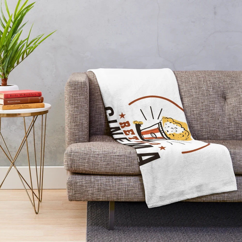 Retro cinema-inspired plush blanket for movie fans