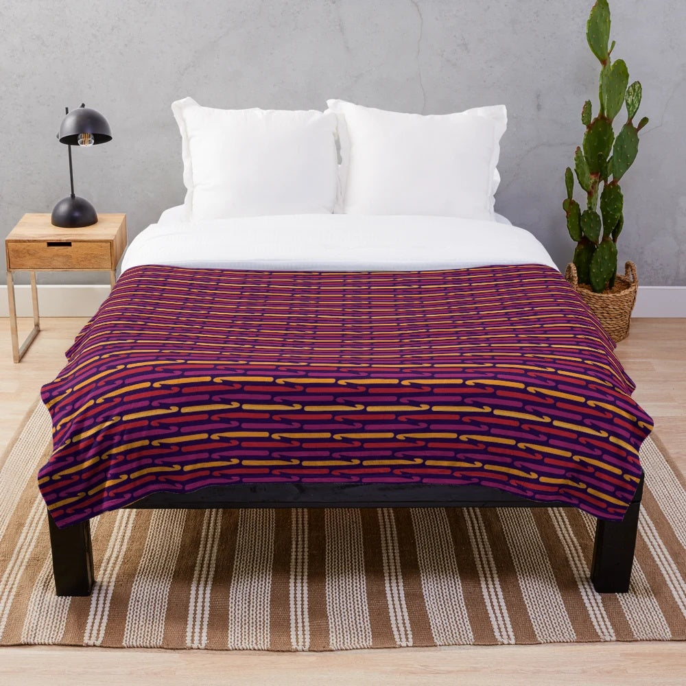 Plush blanket featuring retro crochet hooks design