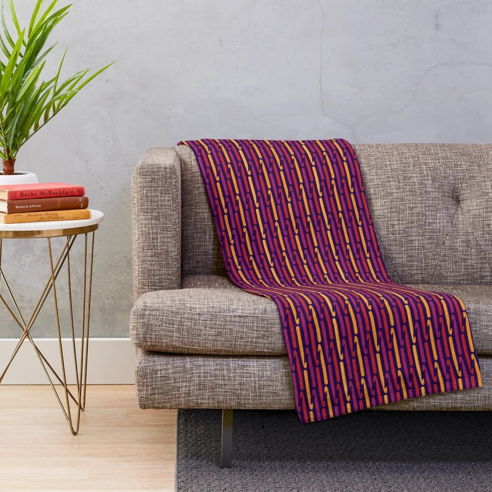 Plush blanket featuring retro crochet hooks design