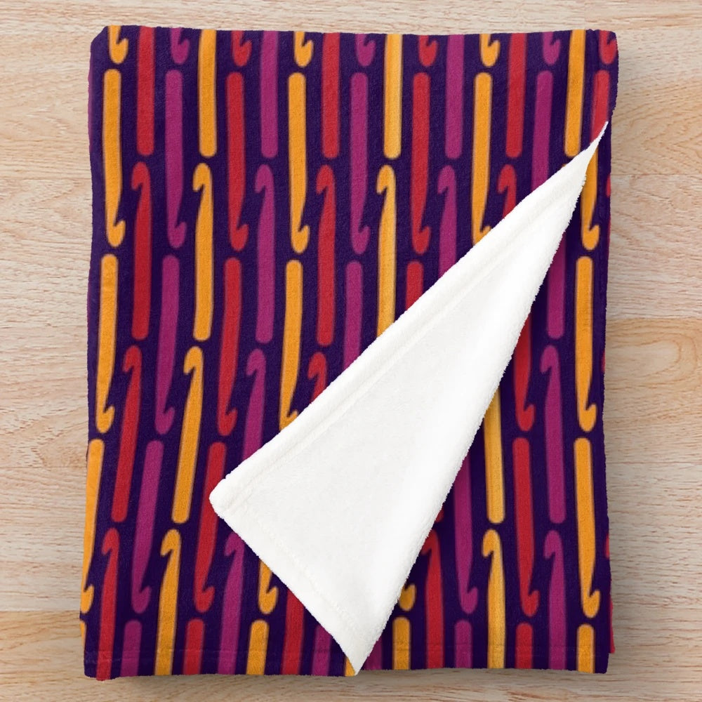 Plush blanket featuring retro crochet hooks design