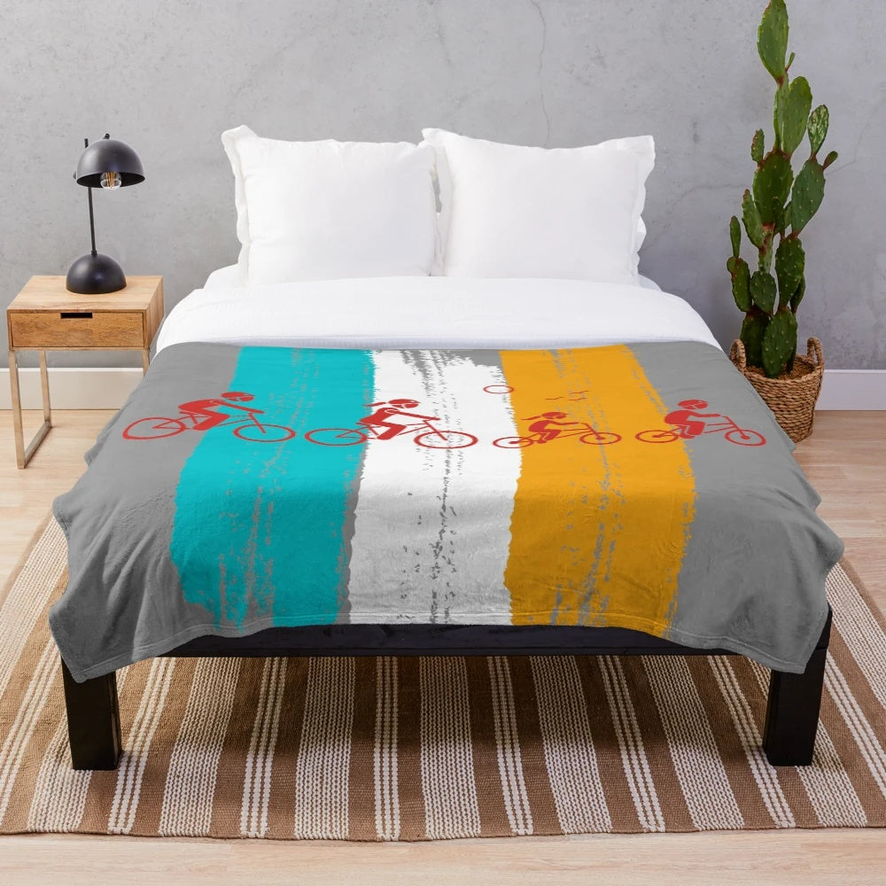 Retro-styled plush blanket featuring family cycling imagery