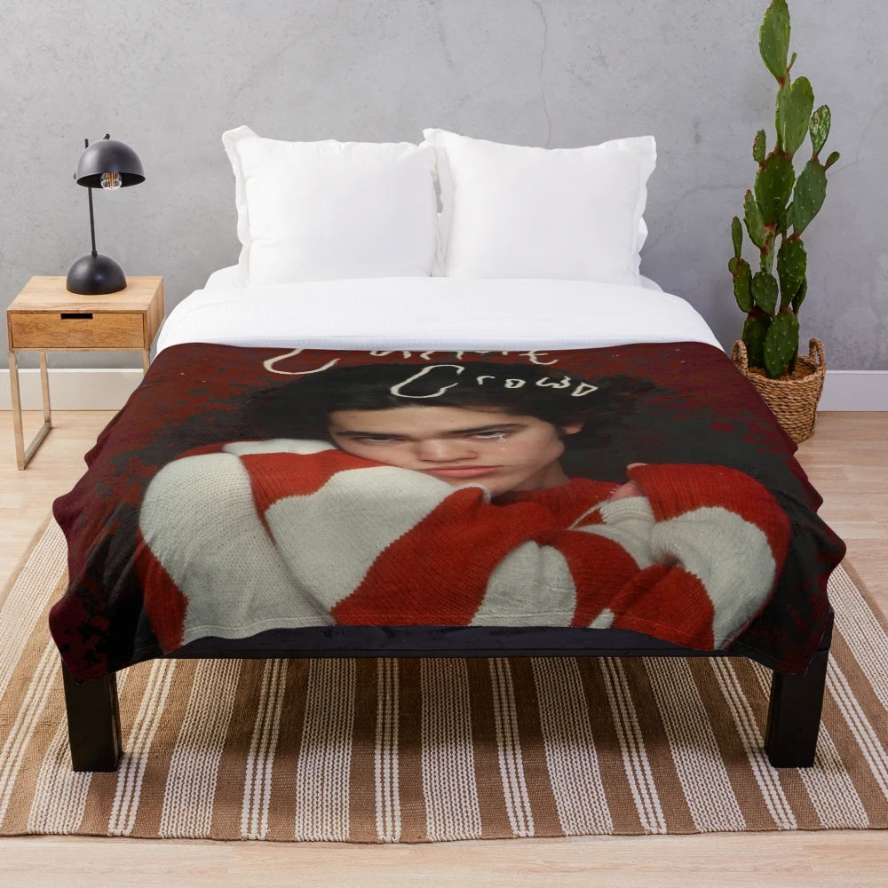 Cozy red plush blanket with retro-inspired music themed pattern