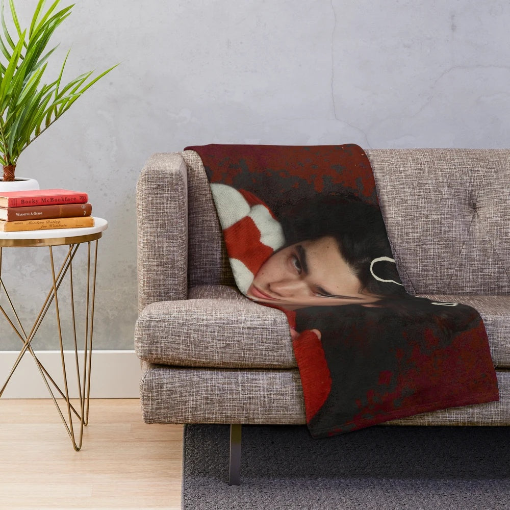 Cozy red plush blanket with retro-inspired music themed pattern