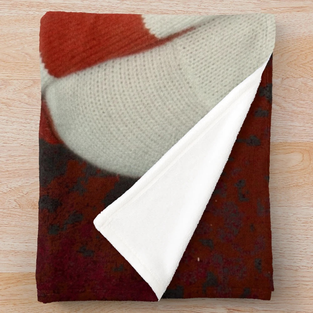 Cozy red plush blanket with retro-inspired music themed pattern