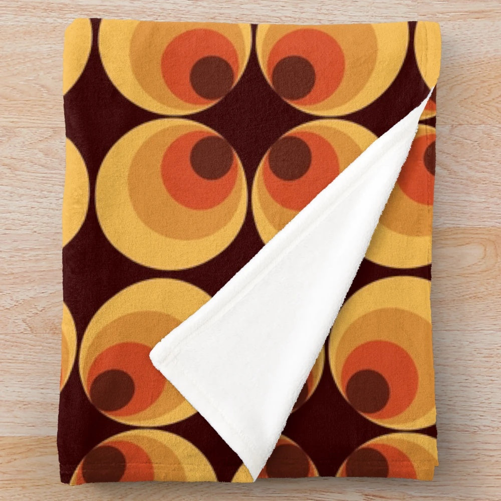 Retro orange plush blanket with circles and 70s aesthetic pattern