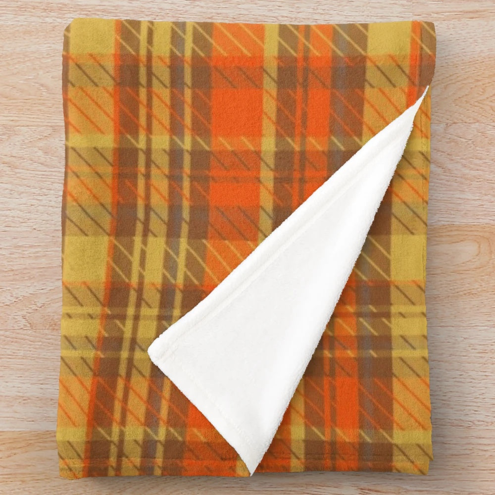 Orange tartan plush blanket with a soft, warm texture