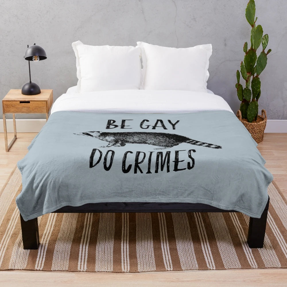 Plush blanket with retro "Be Gay, Do Crimes" LGBTQ pride design