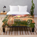 Plush retro-inspired blanket with classic car and diner motifs