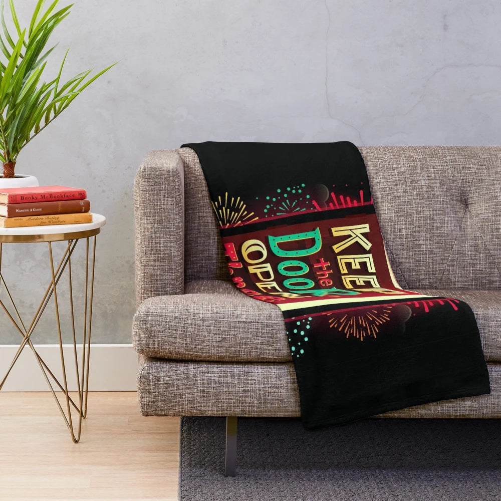 Plush blanket with a retro sci-fi inspired design featuring neon colors and fireworks