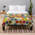 Plush polka dot blanket in autumn colors