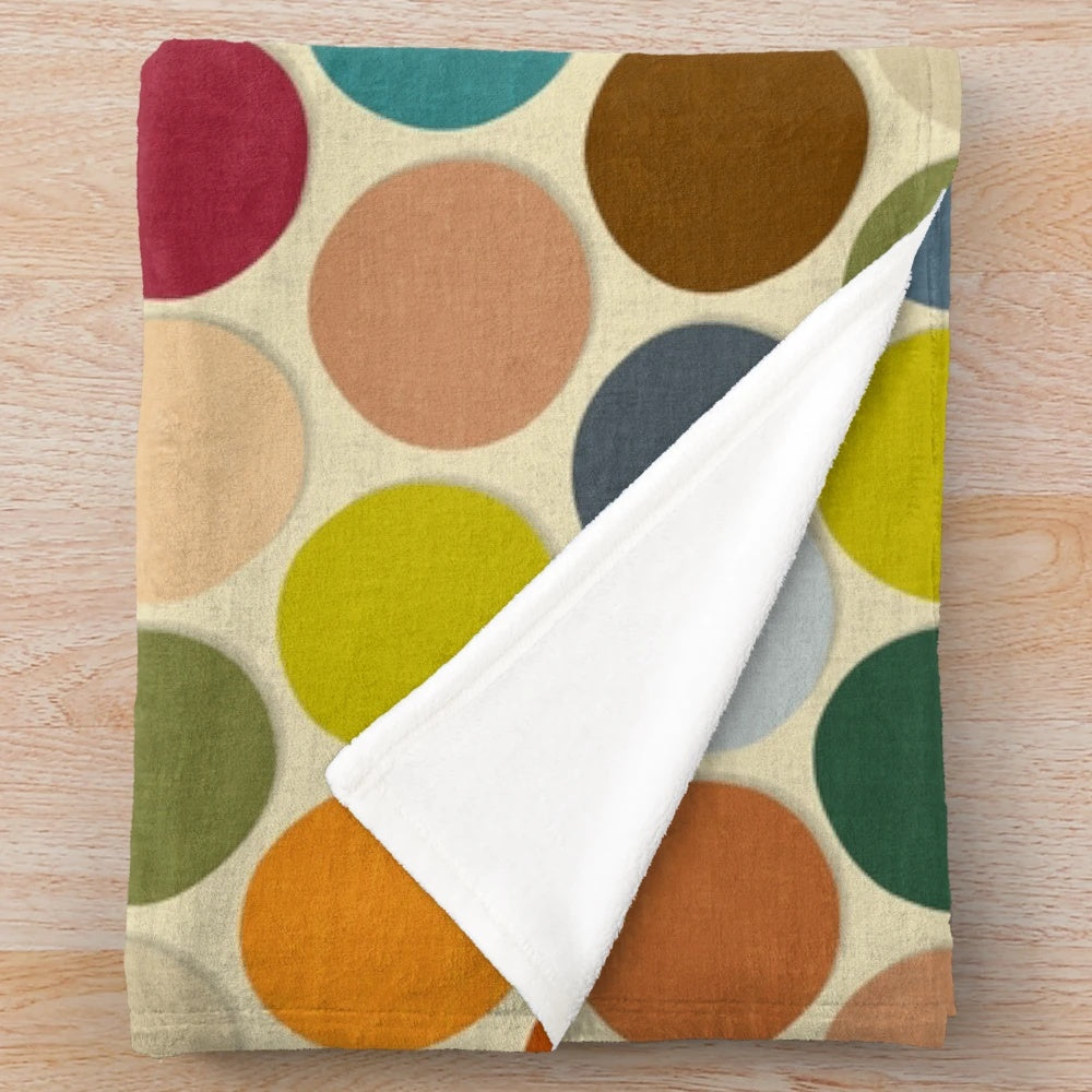 Plush polka dot blanket in autumn colors