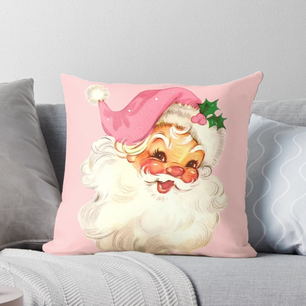 A plush, pink pillow featuring a vintage-style illustration of Santa Claus in a retro design.
