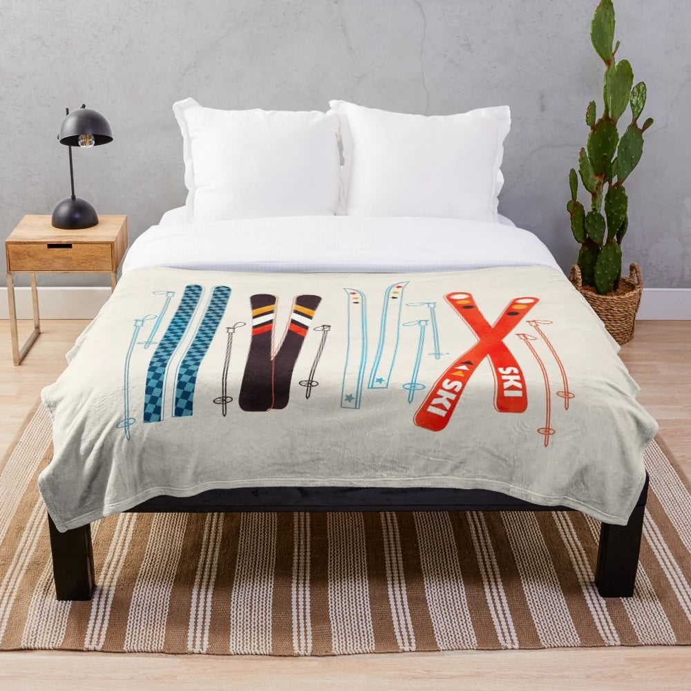 Colorful retro ski illustration printed on a soft, plush blanket